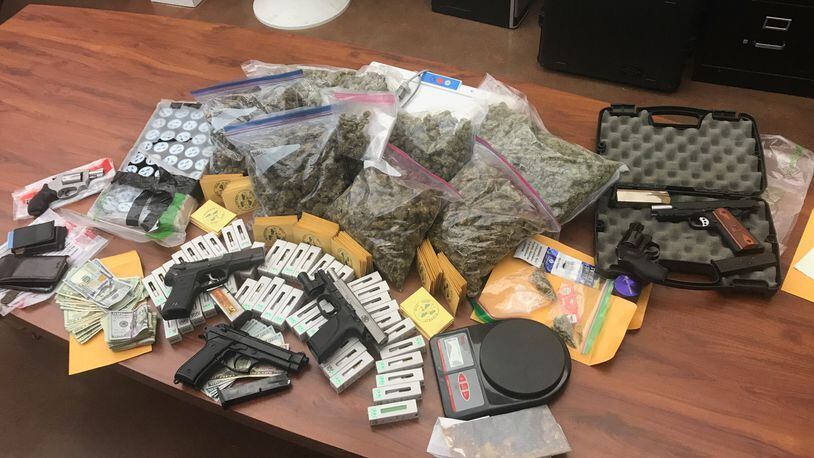 Marijuana, hash oil, and vaping devices pre-loaded with a marijuana substance as well as multiple firearms — some of which had been reported stolen — and more than $3,000 in cash were seized Tuesday from a house in the 5300 block of Sandstone Drive in Fairfield.
