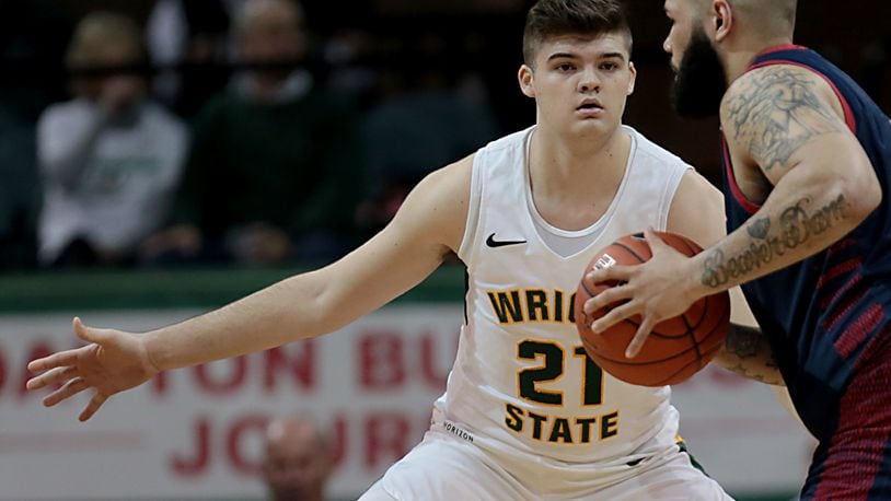 Wright State University forward Grant Basile covers Detroit Mercy forward Justin Miller during their Horizon League game at the Nutter Center in Fairborn Thursday, Feb. 6, 2020. Wright State won 98-86. Contributed photo by E.L. Hubbard