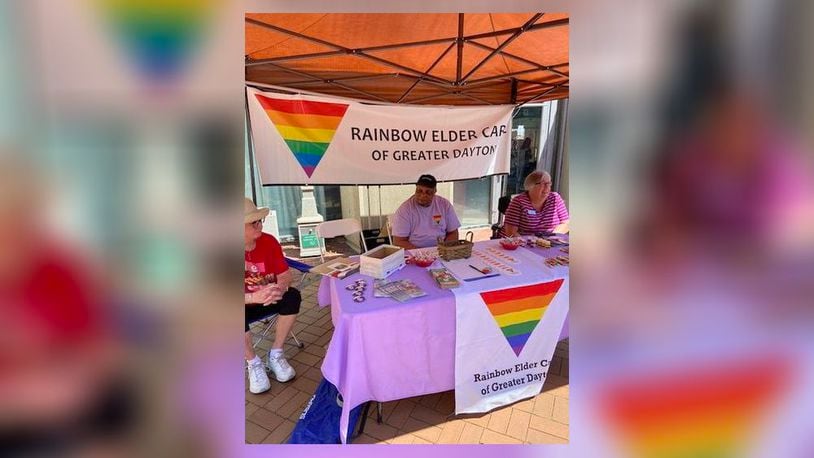 Members of the Rainbow Elder Care board staff a booth at a previous Dayton PRIDE event. CONTRIBUTED