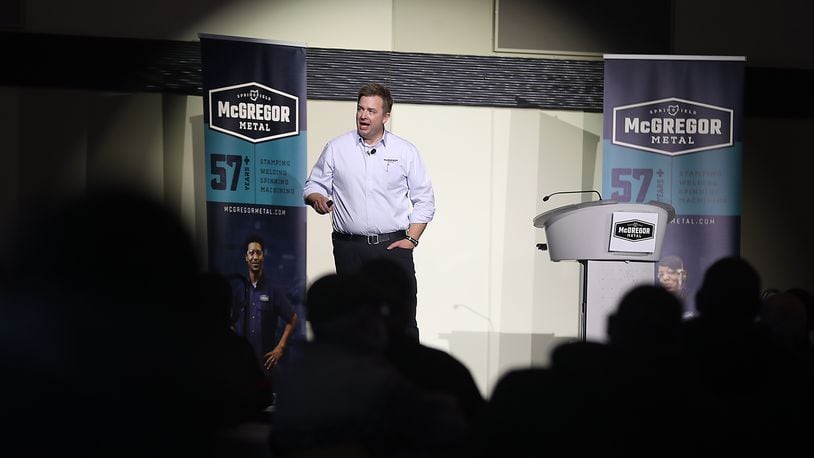 Jamie McGregor, CEO of McGregor Metalworking, was under the spotlight Wednesday morning as he announces the rebranding of all their Clark County companies under one name, McGregor Metal, during a meeting at the Hollenbeck Baley Conference Center. BILL LACKEY/STAFF