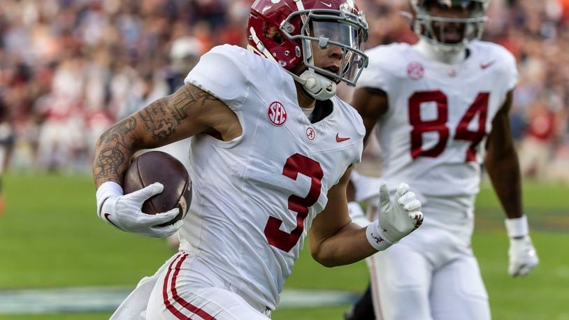 Alabama wide receiver Jermaine Burton (3) runs into the end zone for a pass-reception touchdown against Auburn during the first half of an NCAA college football game, Saturday, Nov. 25, 2023, in Auburn, Ala. (AP Photo/Vasha Hunt)