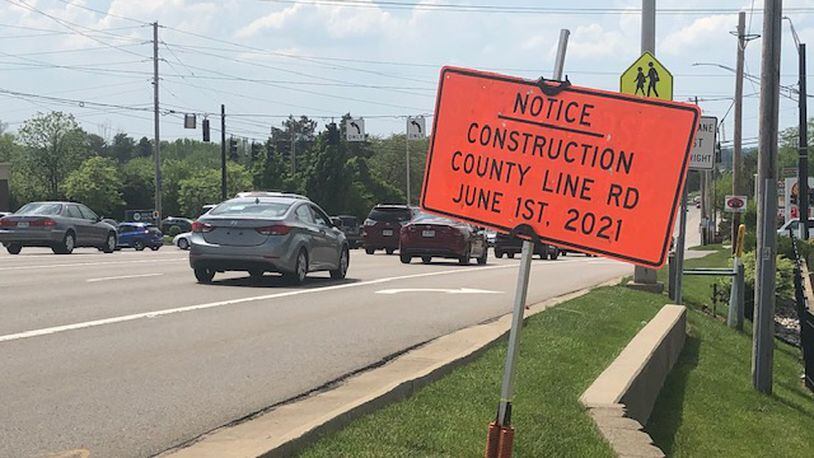 A sign has been put near County Line Road in Kettering as the widening is expected to start in June. NICK BLIZZARD/STAFF