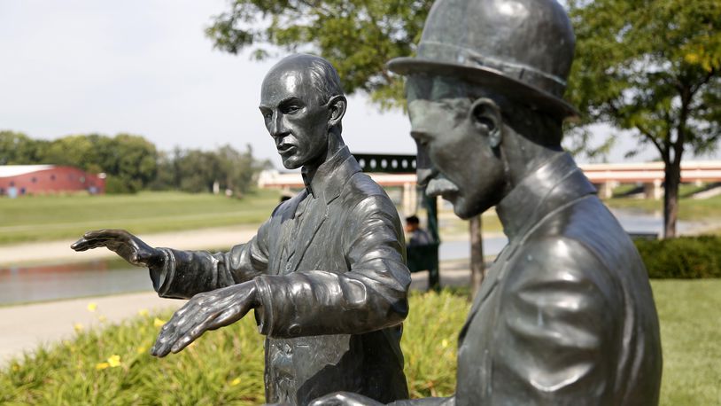 At Deeds Point, two life-sized statues of Orville and Wilbur Wright commemorate the beginnings of aircraft control. The statue captures Orville twisting a bicycle inner tube box as Wilbur explains his scheme for warping wings. LISA POWELL / STAFF