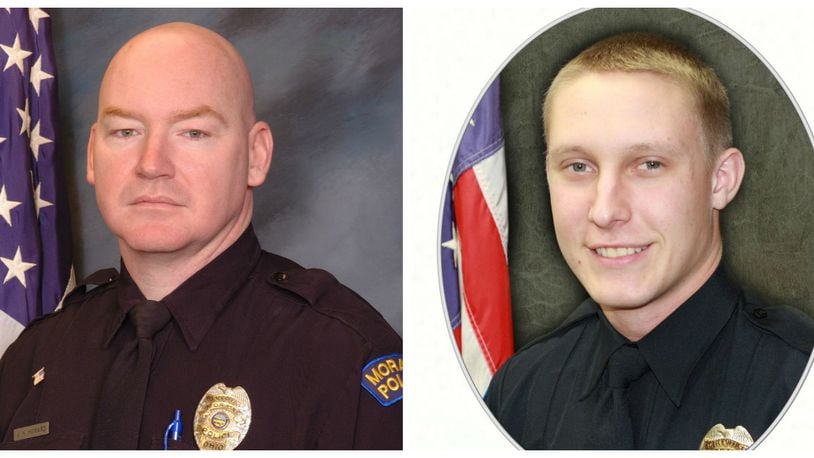 Moraine officers John Howard and Jerry Knight (right) returned to full duty this week after the shooting death of a Dayton man. A state investigation into the shooting continues. SUBMITTED