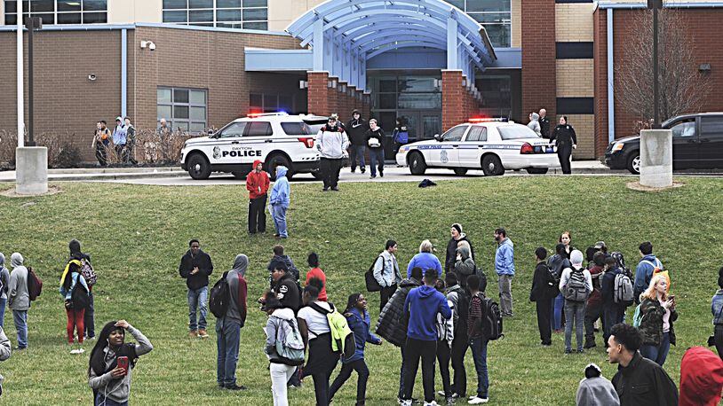 Many Belmont High School students evacuated the building in Dayton last week after rumors circulated that another student was inside with a gun. Police said a student had made threats but took him into custody earlier that day away from school. MARSHALL GORBY / STAFF