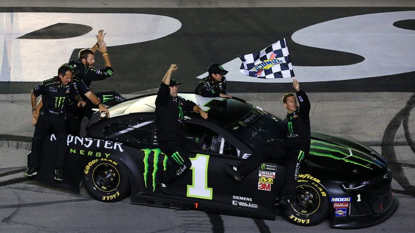 Kurt Busch, driver of the #1 Monster Energy Chevrolet, celebrates with his crew members after winning the Monster Energy NASCAR Cup Series Quaker State 400 Presented by Walmart at Kentucky Speedway on July 13, 2019 in Sparta, Ky. (Daniel Shirey/Getty Images/TNS)