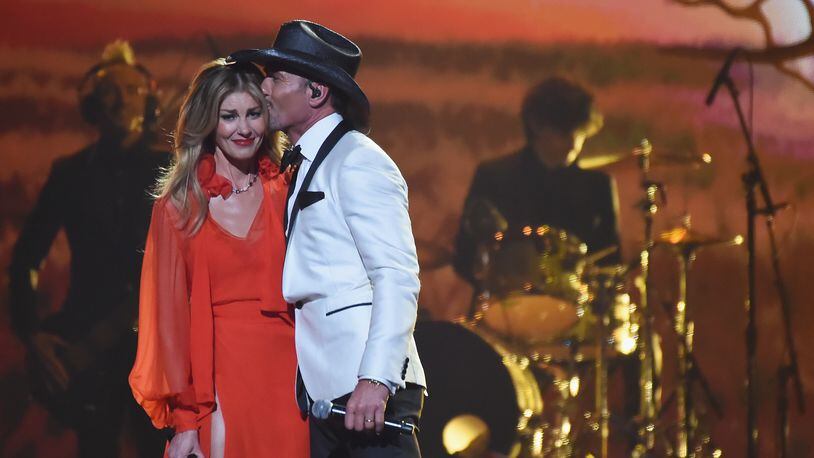 NASHVILLE, TN - NOVEMBER 08:  Faith Hill and Tim McGraw perform onstage at the 51st annual CMA Awards at the Bridgestone Arena on November 8, 2017 in Nashville, Tennessee.  (Photo by Rick Diamond/Getty Images)