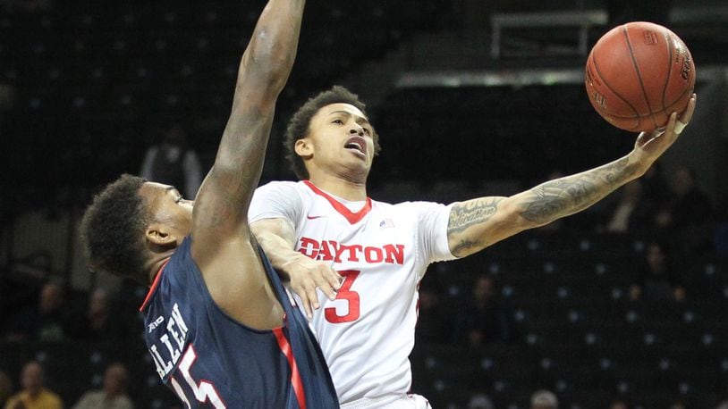 Dayton’s Kyle Davis scores against Richmond’s Terry Allen in the quarterfinals of the Atlantic 10 tournament on Friday, March 11, 2016, at the Barclays Center in Brooklyn, N.Y. David Jablonski/Staff