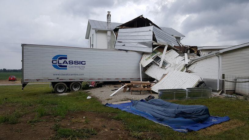 This semitrailer was driven into a house on U.S. 36 in Darke County on Wednesday afternoon, Aug. 10, 2016. The two people in the rig were trapped inside for a time, deputies said. (Courtesy: Clinton Randall/Bluebag Media)