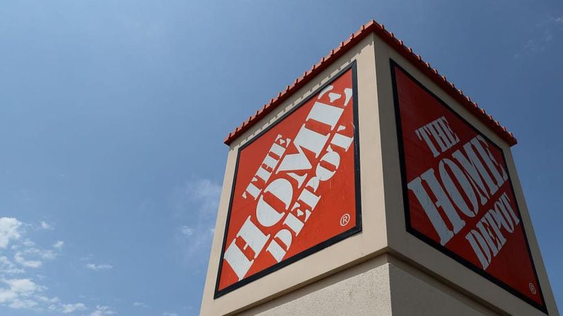 Police said a sheriff's officer and a Home Depot employee conspired to take more than $5,000 worth of merchandise without paying for it.