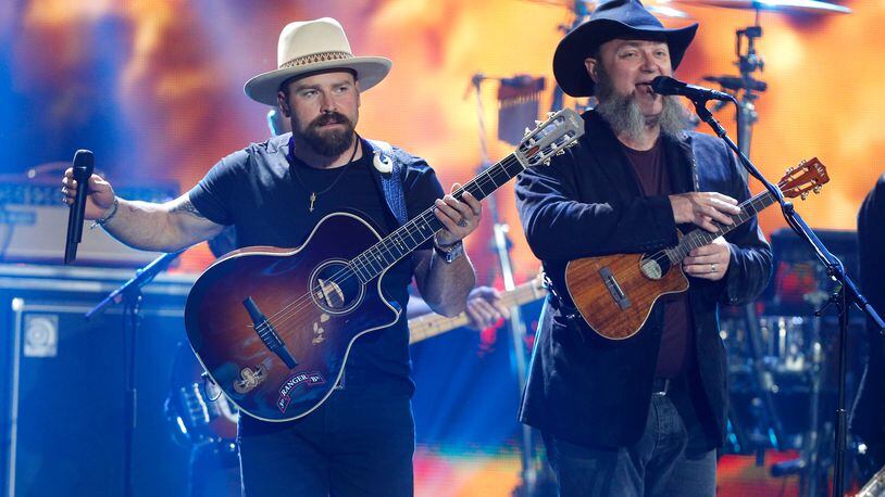 AUSTIN, TX - APRIL 30: Singer Zac Brown (L) and John Driskell Hopkins of Zac Brown Band perform onstage on April 30, 2016 in Austin, Texas. (Photo by Bob Levey/Getty Images)