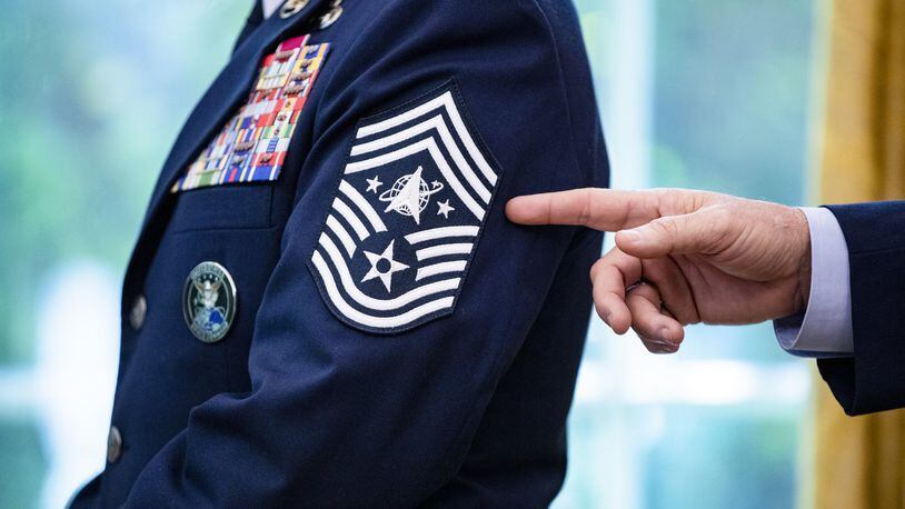 The newly designed rank insignia of U.S. Air Force Space Command, Chief Master Sgt. Roger Towberman, is pointed to. (Samuel Corum /The New York Times)