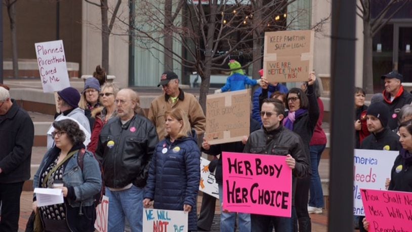 Pro-Planned Parenthood protesters gather in downtown Dayton in February. JORDYN HUFFMAN / STAFF