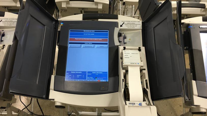 An electronic touch screen voting machine is set up for testing at the Montgomery County Board of Elections. The paper spool will be enclosed at the polls. LYNN HULSEY/STAFF
