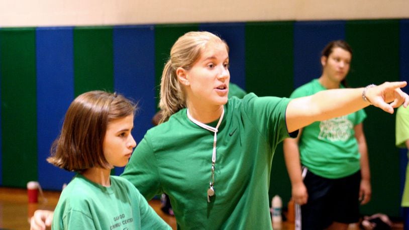 Former CJ star Megan Duffy gives some pointers to Sarah Reymann of Oakwood during Chaminade Julienne’s girls basketball camp in 2009. FILE PHOTO