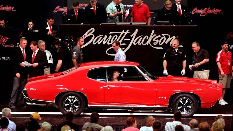 A 1969 Pontiac GTO 2-door hardtop rolls onto the auction block at Barrett Jackson Auction in Scottsdale. Barrett-Jackson photo
