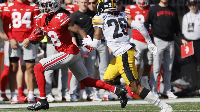Ohio State receiver Marvin Harrison, left, cuts up field against Iowa defensive back Kaevon Merriweather during the second half of an NCAA college football game Saturday, Oct. 22, 2022, in Columbus, Ohio. (AP Photo/Jay LaPrete)