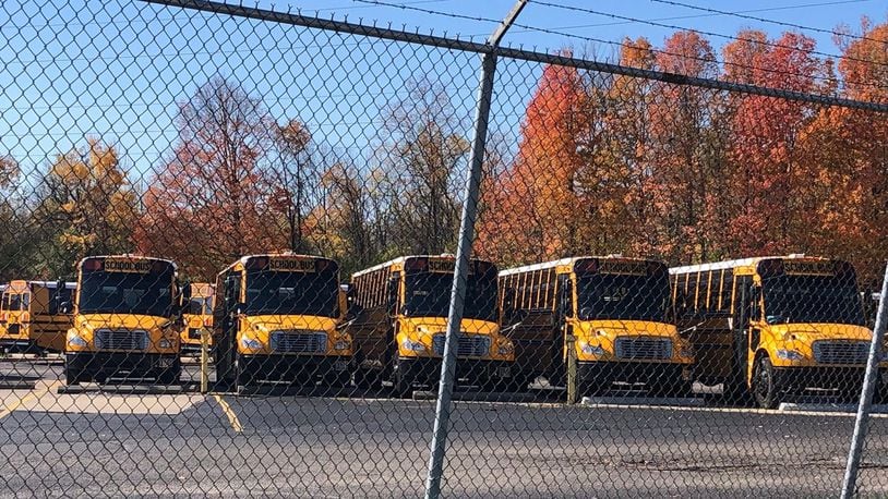 Dozens of buses sit in Dayton Public Schools’ transportation center on James H. McGee Boulevard. JEREMY P. KELLEY / STAFF
