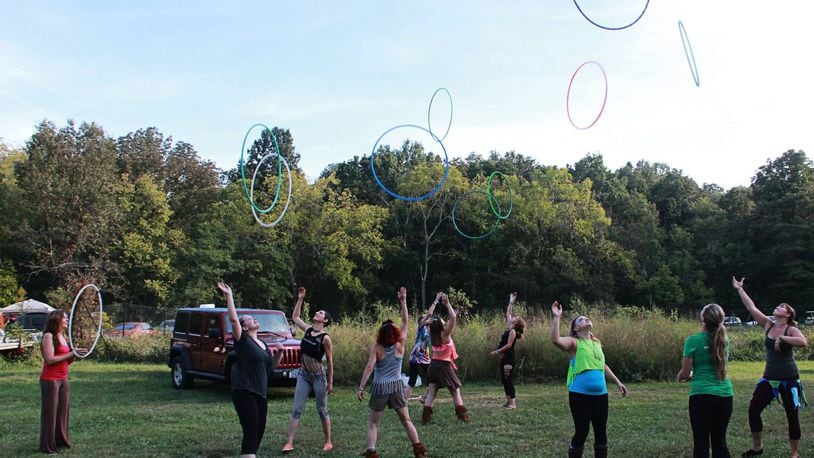 Lucy Tenhundfeld will share her love of hula hooping on March 7 at Haven Studio in Middletown. Shown is a similar event at Terrapin Hill Farm in Kentucky. CONTRIBUTED