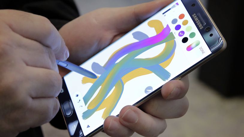 FILE - In this July 28, 2016, file photo, a color blending feature of the Galaxy Note 7 is demonstrated in New York. Consumers who bought the Galaxy Note 7 are having a wide range of responses in dealing with Samsung’s recall of the smartphone, which has been catching fire. (AP Photo/Richard Drew, File)
