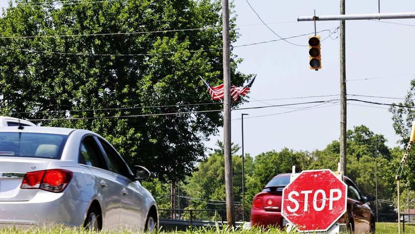 Temporary stop signs were up at some intersections, like this one at Verity Parkway and 14th Ave., as signal lights were out due to power outages. Many were still without power Tuesday, June 14 in Middletown after storms damaged trees and knocked down power lines. NICK GRAHAM/STAFF
