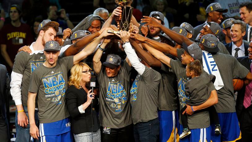 The members of the Golden State Warriors celebrate after winning the NBA Finals against the Cleveland Cavaliers in Cleveland on June 17, 2015. The Warriors defeated the Cavaliers 105-97 to win the best-of-seven game series 4-2.