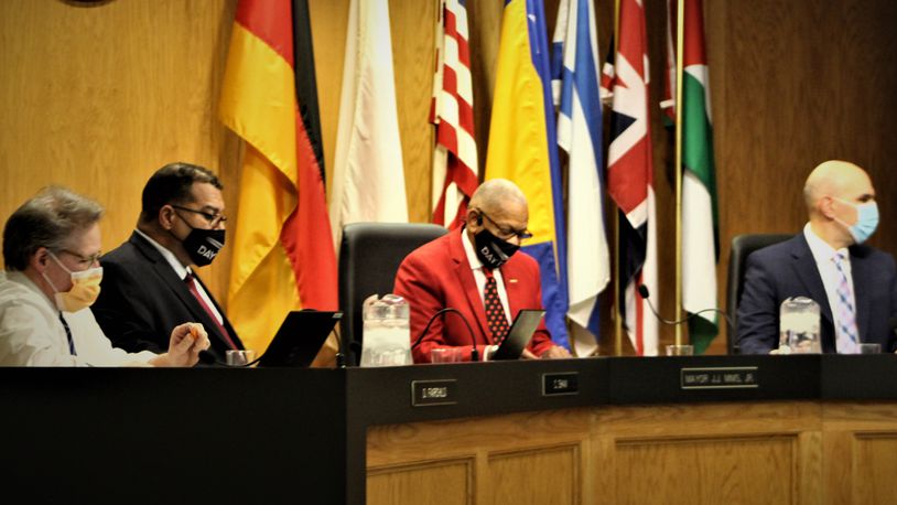 Dayton City Commissioners wear masks at the Wednesday city commission meeting. The city has reinstated its mask requirement for employees. CORNELIUS FROLIK / STAFF