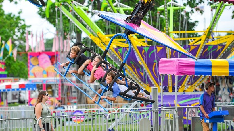 Fair attendees take a ride at the Butler County Fair Monday, July 23 in Hamilton. NICK GRAHAM/STAFF