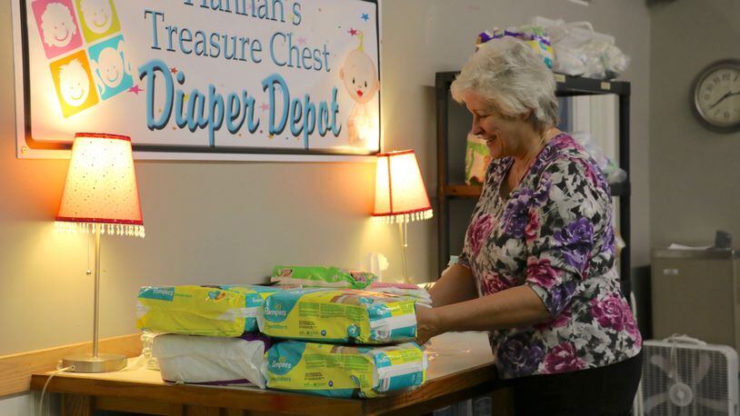 Hannah’s Treasure Chest volunteer Barbara Keelor is known as the “Diaper Diva,” bundling diapers for distribution to the nonprofit organization’s clients. CONTRIBUTED