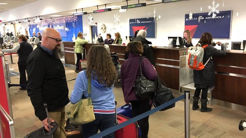 Travelers at the Dayton International Airport, Wednesday, Dec. 21, 2016.