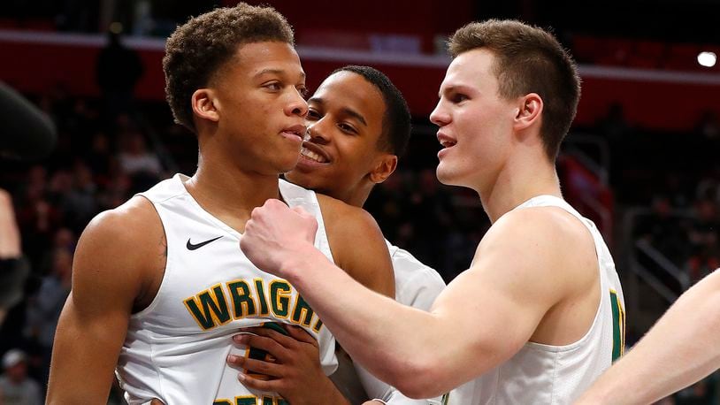 Wright State’s Everett Winchester, left, celebrates a basket with Jaylon Hall and Grant Benzinger during the second half of the team’s NCAA college basketball game against Cleveland State for the championship in the Horizon League men’s tournament in Detroit, Tuesday, March 6, 2018. (AP Photo/Paul Sancya)