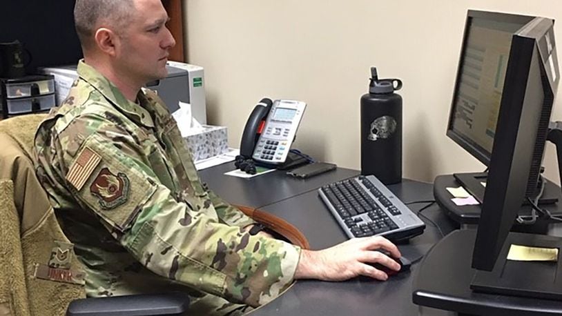 Tech. Sgt. Gregory Linker, 88th Air Base Wing Military Personnel Flight section chief, Career Development, observes permanent change of station processing practices, percentages and customer service data to make processes lean and timely. (U.S. Air Force photo/Kimberly Gaither)