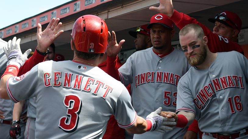 SAN FRANCISCO, CA - MAY 16: Scooter Gennett #3 of the Cincinnati Reds is congratulated by teammates Tucker Barnhart #16 and Wandy Peralta #53 after Gennett hit a solo home run against the San Francisco Giants in the top of the seventh inning at AT&T Park on May 16, 2018 in San Francisco, California. (Photo by Thearon W. Henderson/Getty Images)