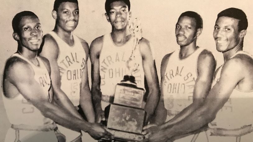 Central State’s starting five (left to right) Clarence Lane, Chris Buchanan, Roy Hinton, Graham Russell and Robert Moore with the NAIA championship trophy. CONTRIBUTED