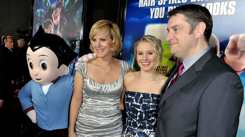 LOS ANGELES, CA - OCTOBER 19: (L-R) Producer Maryann Garger, actress Kristen Bell and director David Bowers arrive at the premiere of Summit Entertainment and Imagi Studios' "Astro Boy" at the Chinese Theater on October 19, 2009 in Los Angeles, California. (Photo by Kevin Winter/Getty Images)
