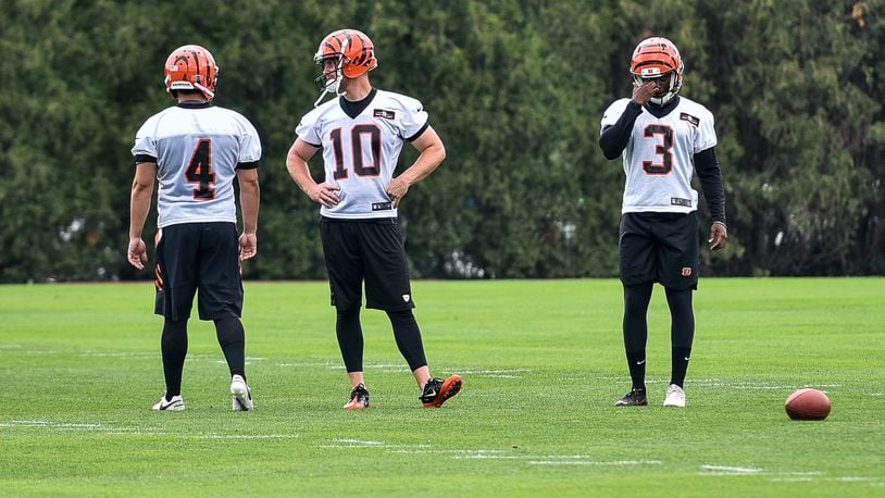 Bengals’ kickers Randy Bullock (4), Kevin Huber (10) and Jonathan Brown (3) prepare for kicking drills during organized team activities Tuesday, May 22 at the practice facility near Paul Brown Stadium in Cincinnati. NICK GRAHAM/STAFF