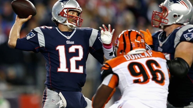 FOXBORO, MA - OCTOBER 05: Tom Brady #12 of the New England Patriots passes during the third quarter against the Cincinnati Bengals at Gillette Stadium on October 5, 2014 in Foxboro, Massachusetts. (Photo by Jim Rogash/Getty Images)