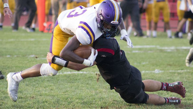 Vandalia-Butler receiver Bryant Johnson is tackled by a Tecumseh defender after one of his eight receptions on Friday, Aug. 31, 2018. He gained 99 yards and scored two touchdowns to help the Aviators to a 49-28 victory. Jeff Gilbert/CONTRIBUTED