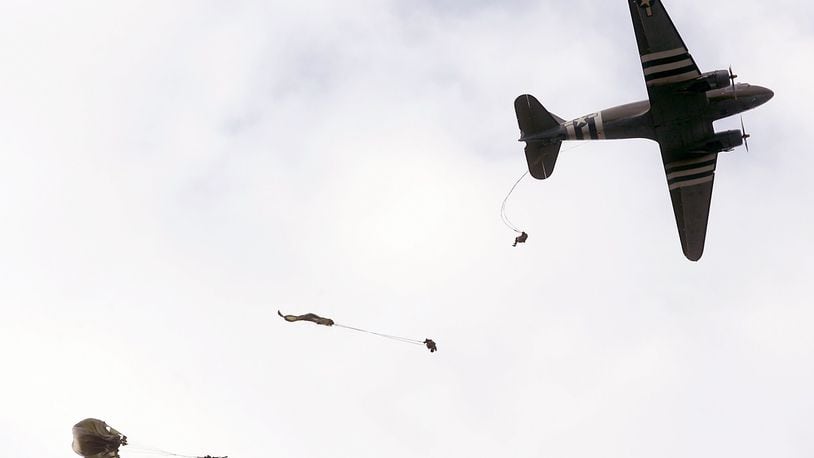 FILE: Parachutists exit a C-47 airplane in a D-Day paratrooper demonstration during the Wings of Freedom air show at Hook Field in Middletown, Ohio Saturday Sept. 20, 2008. Staff photo by Pat Auckerman