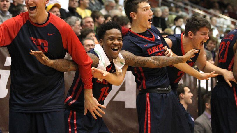 Dayton players (left to right) Bobby Wehrli, John Crosby, Ryan Mikesell and Sam Miller celebrate a basket in the second half against St. Bonaventure on Tuesday, Jan. 19, 2016, at the Reilly Center in Olean, N.Y. David Jablonski/Staff