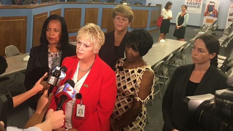 Dayton Public Schools administrators address media questions about their contract dispute with teachers. From left are Treasurer Hiwot Abraha, Superintendent Rhonda Corr, Associate Superintendent Elizabeth Lolli, Associate Superintendent Shelia Burton and legal counsel Jyllian Bradshaw. JEREMY P. KELLEY / STAFF