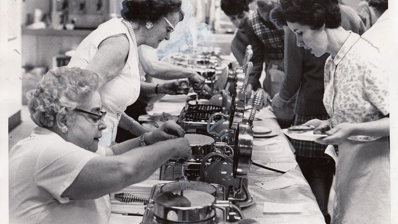 Christ Episcopal Church’s Women of the Parochial Society, one of eight women’s groups at the church at the time, launched Waffle Shop in 1929.  
The holiday fundraiser has grown over the years. 
Photo: Dec. 3, 1969 by Al Wilson, Journal Herald.