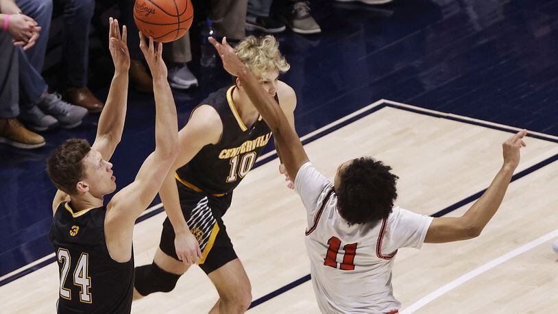 Centerville's Rich Rolf shoots over Fairfield's Logan Woods during Saturday night's Division I regional final at Xavier's Cintas Center. Nick Graham/STAFF