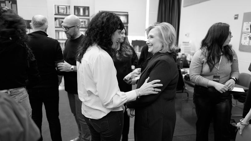 This photo provided by Rubenstein shows Director Leigh Silverman talking with former Secretary of State Hillary Rodham Clinton during a rehearsal for the off-Broadway musical “Suffs” in New York. Clinton and Shaina Taub are joining together as producers of the musical about the suffragist movement. (Jenny Anderson via AP)