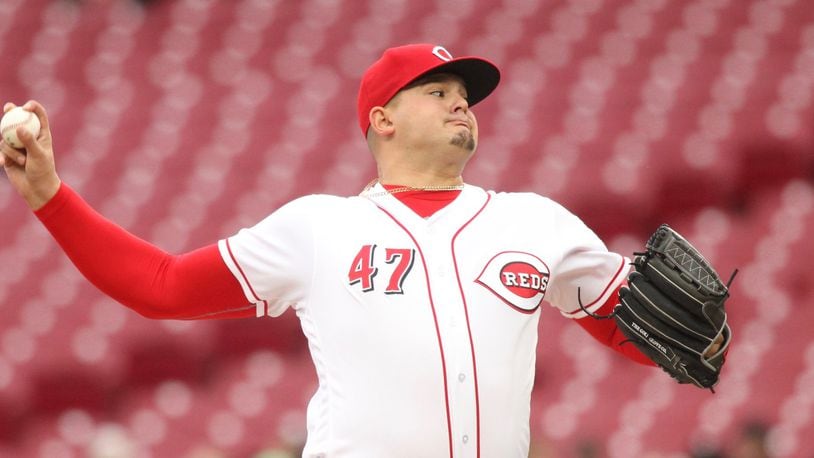 Reds starter Sal Romano pitches against the Braves on Monday, April 23, 2018, at Great American Ball Park in Cincinnati. David Jablonski/Staff