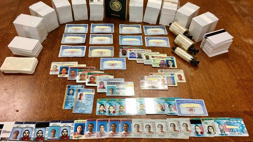 Several forms of fake identification cards were seized from two Dayton residences as part of a United States Secret Service investigation. Two men were sentenced Wednesday to 24 and 21 months in prison. MARK GOKAVI/Staff