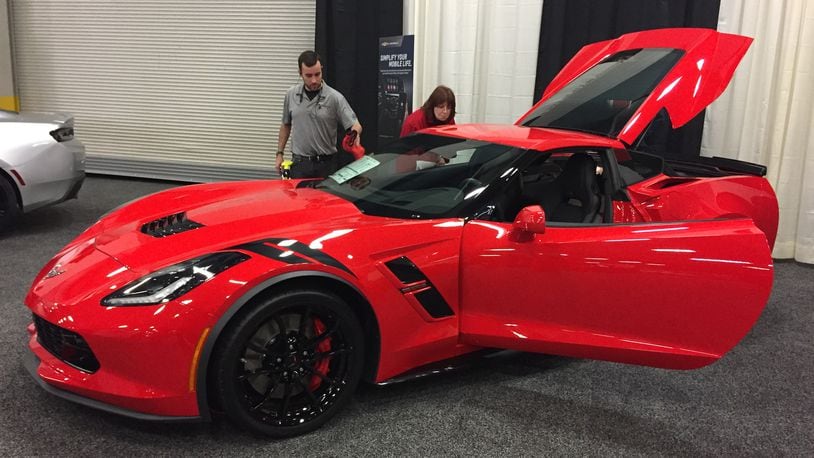 Lighting up the Dayton Auto Show in Torch Red is the 2018 Chevrolet Corvette Grand Sport Coupe, with an MSRP of more than $73,000. AMY ROLLINS / STAFF