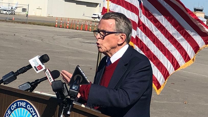 Gov. Mike DeWine flew into Lunken Airport in Cincinnati Friday afternoon to address the surge of coronavirus cases in the state, including counties in Southwest Ohio. RICK McCRABB/STAFF