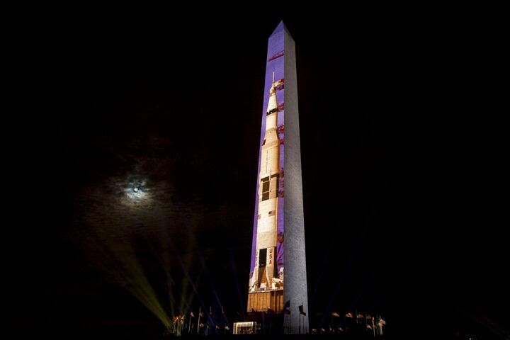 Photos: Apollo 11 Saturn V rocket lights up Washington Monument