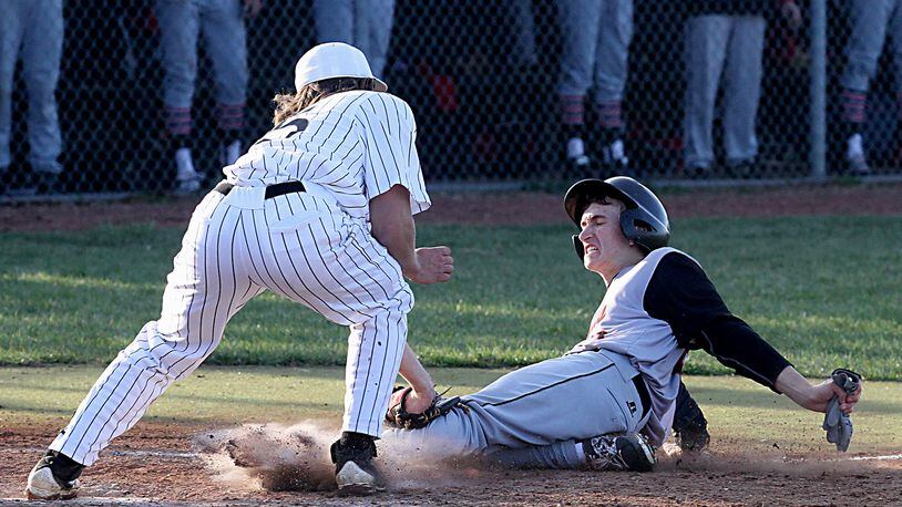 Lakota East’s Jefferson Szydlowski tags out Oak Hills’ Drew Wetterich at home plate to end the game Tuesday at East. CONTRIBUTED PHOTO BY E.L. HUBBARD